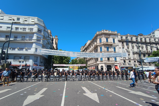 Police officers standing in a line on the street