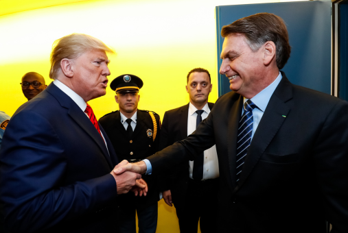 Former Presidents of the United States, Donald Trump, and of Brazil, Jair Bolsonaro, shaking hands at the United Nations headquarters in New York in September 2019. Trump appears energetic and emphatic, while Bolsonaro smiles