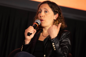 Woman speaks into microphone
