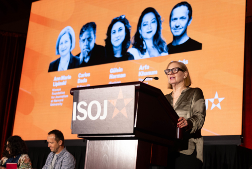 Woman wearing glasses at podium
